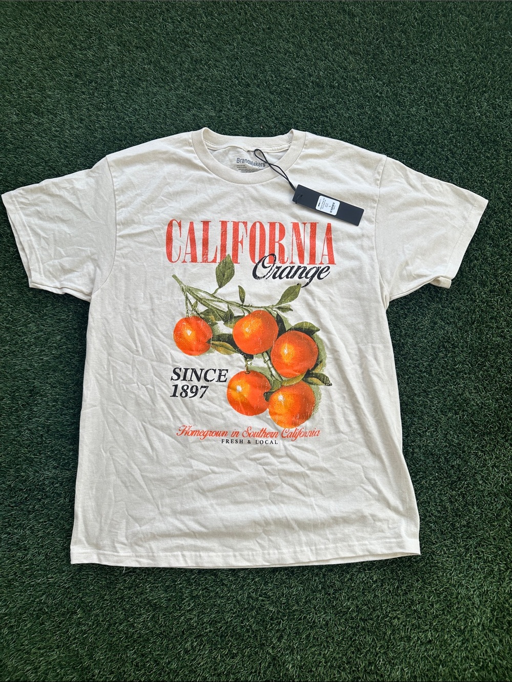 Fashion Nova Cream Tee with Orange Graphic